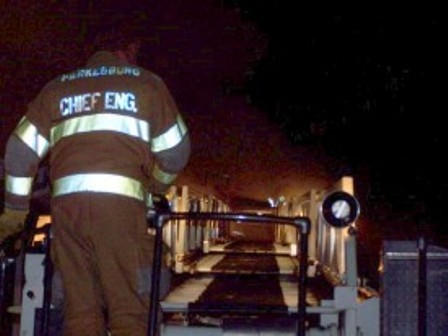 Chief Engineer Meyers on the turn table of Tower 28 at the Helen St. fire.